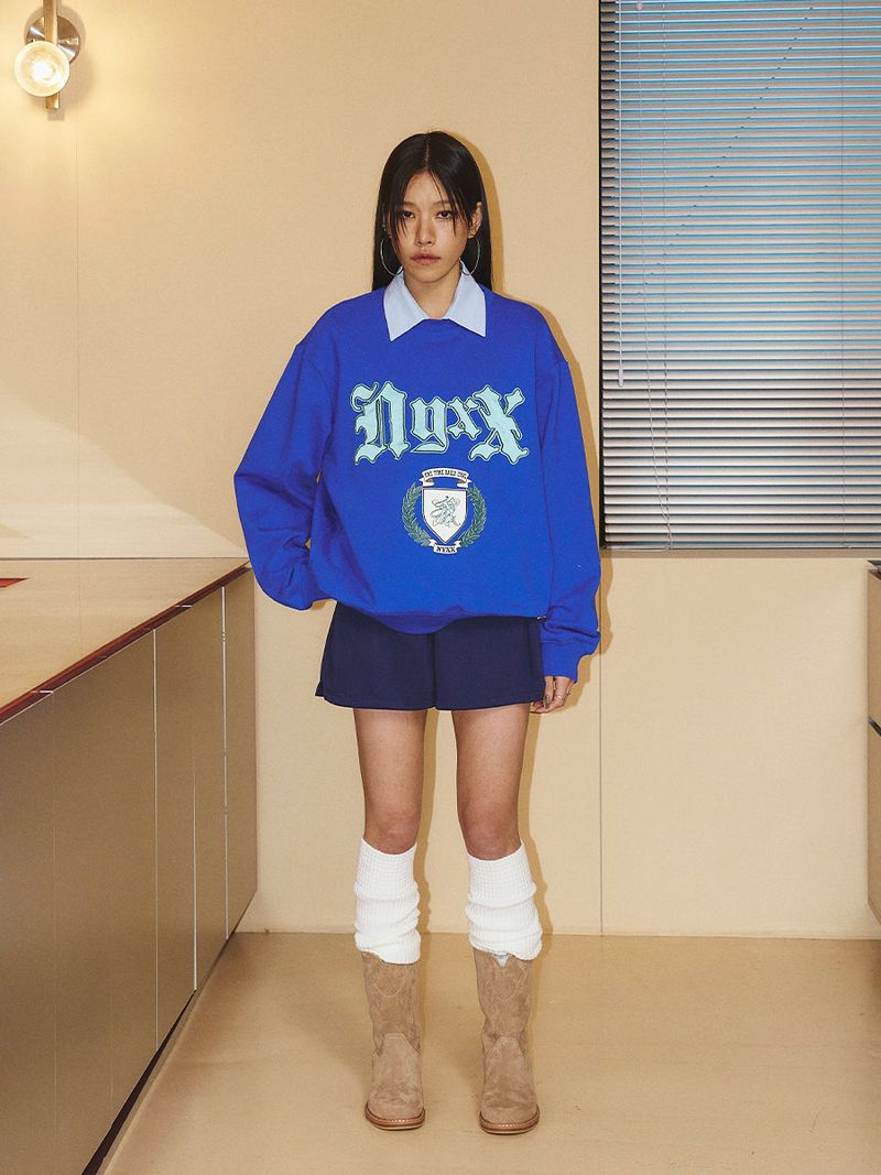 NYXX（エヌワイエックスエックス）の「EMBLEM PATCHWORK SWEATSHIRT (BLUE)（Tops）」