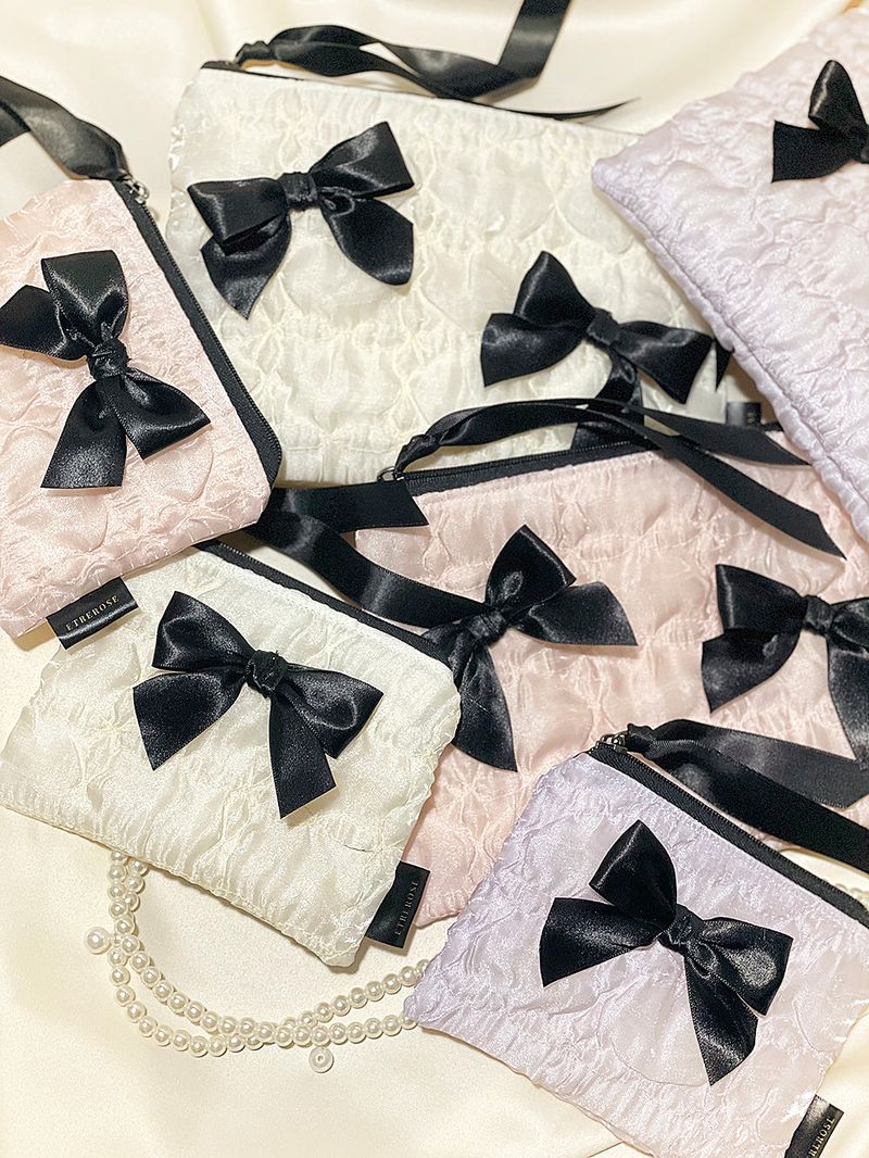 ETREROSE（エトレロゼ）の「グロッシーオーガンザリボンジップポーチ (SET（スマホグッズ/小物）」