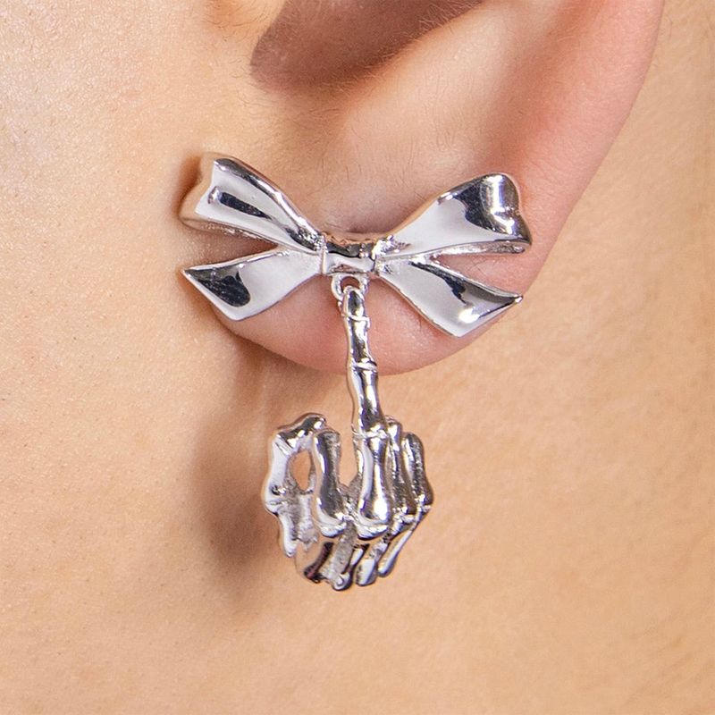 Ribbon w/ skeleton middle finger earrings