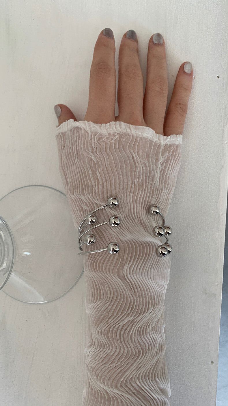 Silver ball piercing bangle