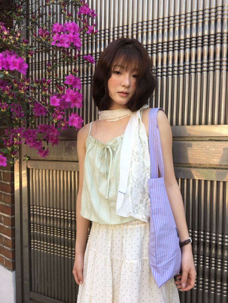DUGGY(ダギー)の「Belle Frill Ribbon Sleeveless (2color)(Tops)」