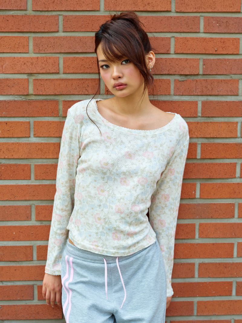 NYXX（エヌワイエックスエックス）の「エンブレム フラワー ロング スリーブ ピンク（トップス）」
