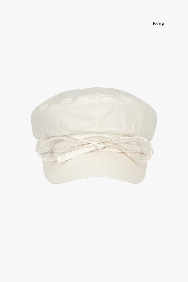 Shelby string newsboy cap