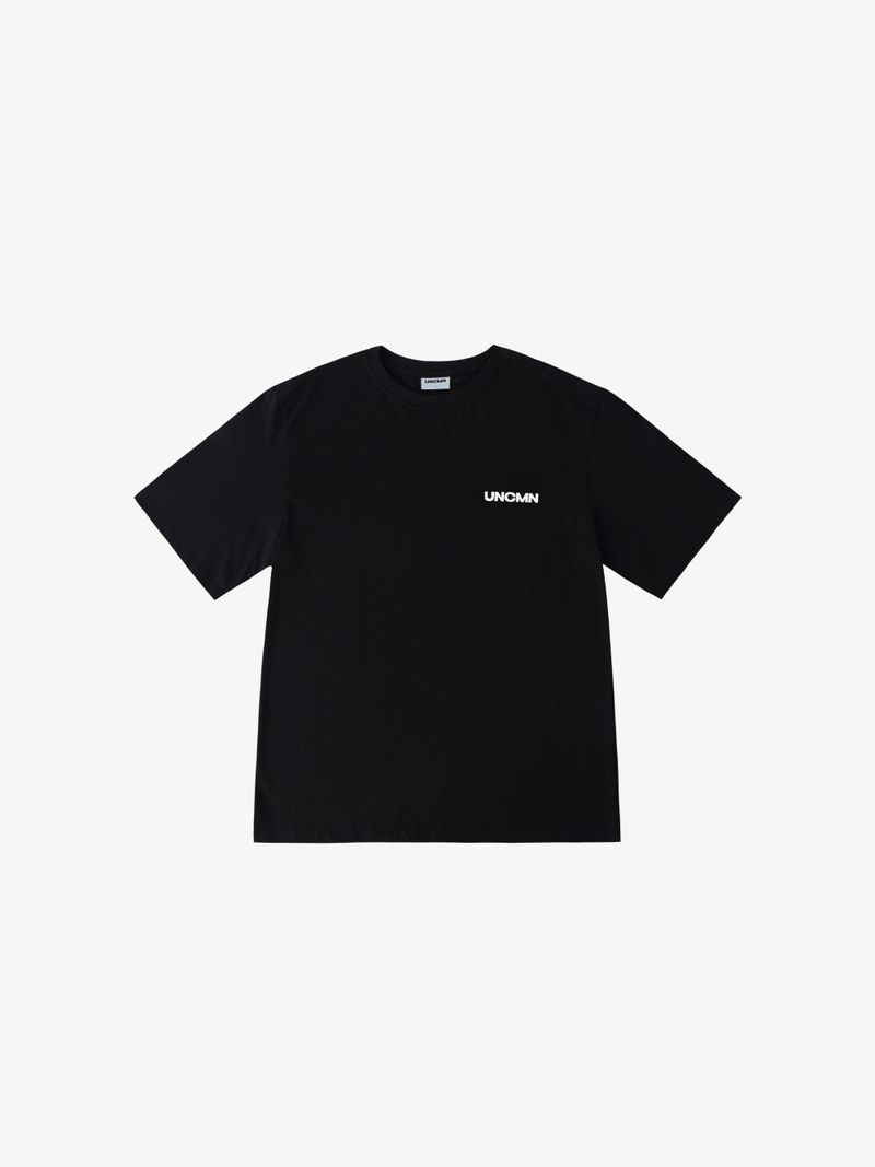 UNCMN（アンカモン）の「LOGO T-SHIRT BLACK（Tops）」