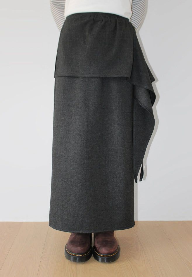 AAKE(アケ)の「(WOOL) TIE STRAP LAYERED SKIRT(Skirts)」