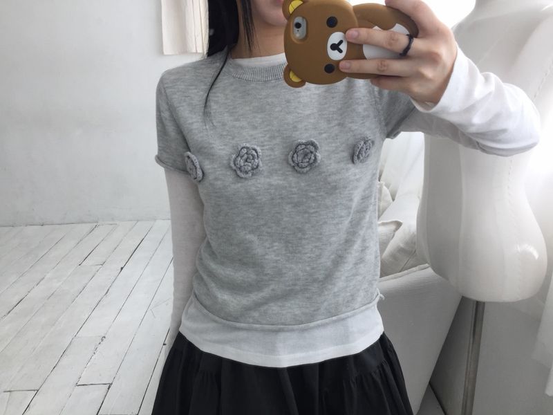 wooon（ウオン）の「フラワーコサージュハーフニット（トップス）」