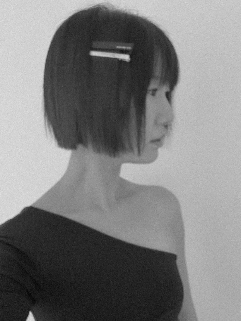 Black logo hair pin