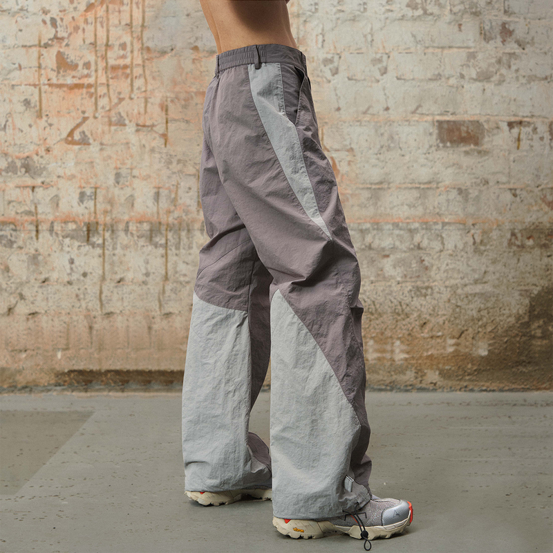 RELABEL 24SS ‘Traveller’ Two-tone Nylon Trousers With Split Drawstring And Linear Body Structure