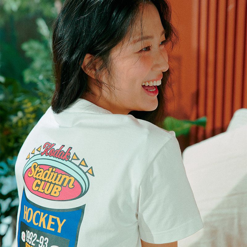 KODAK（コダック）の「STADIUM GRAPHIC T-SHIRT【WHITE】（Tops）」