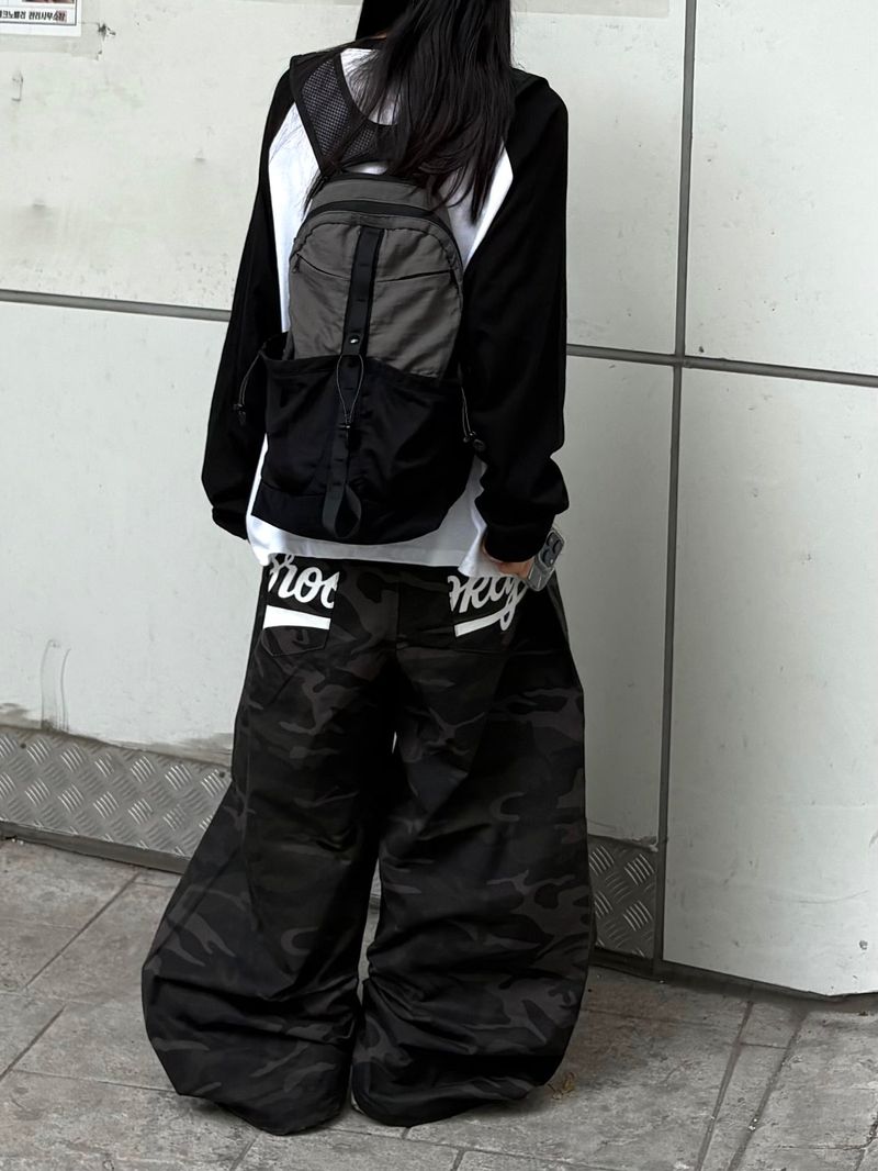 dual pocket mesh backpack