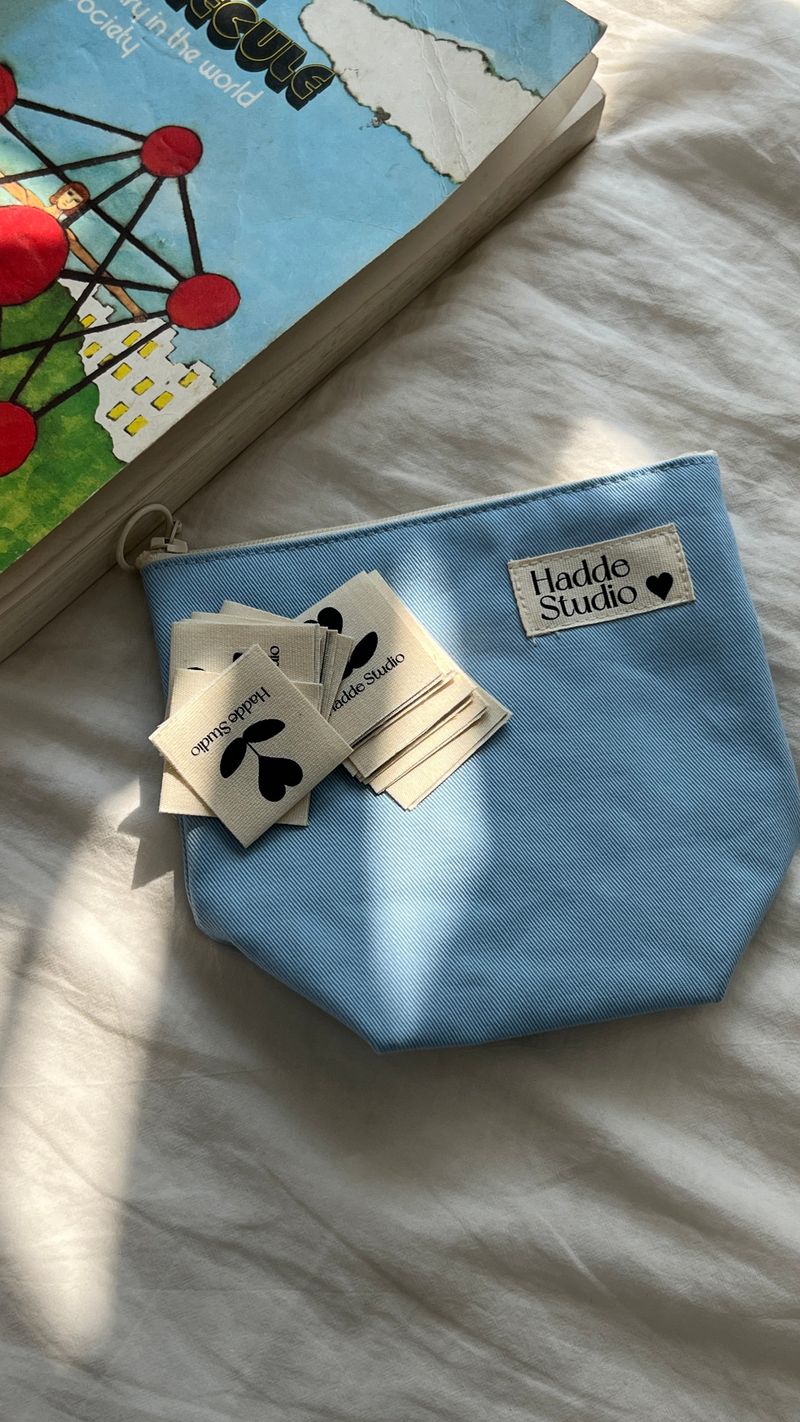 HADDE LOGO LABEL POUCH BAG