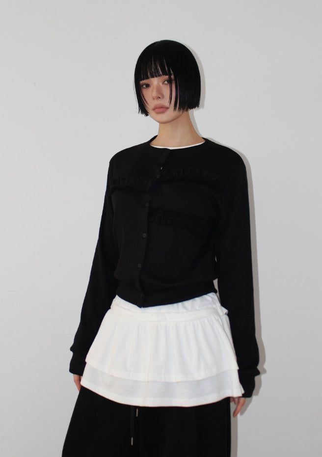 AAKE(アケ)の「FRILL RIB KNIT CARDIGAN(Tops)」