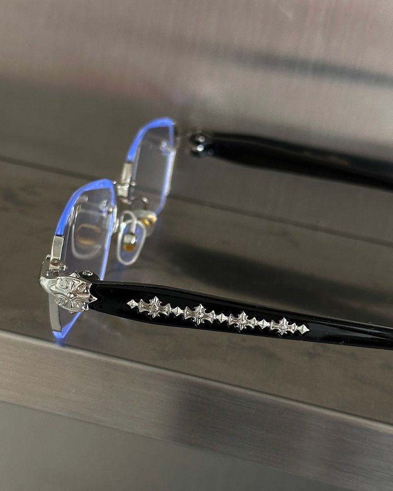 chrome cross-rimmed glasses