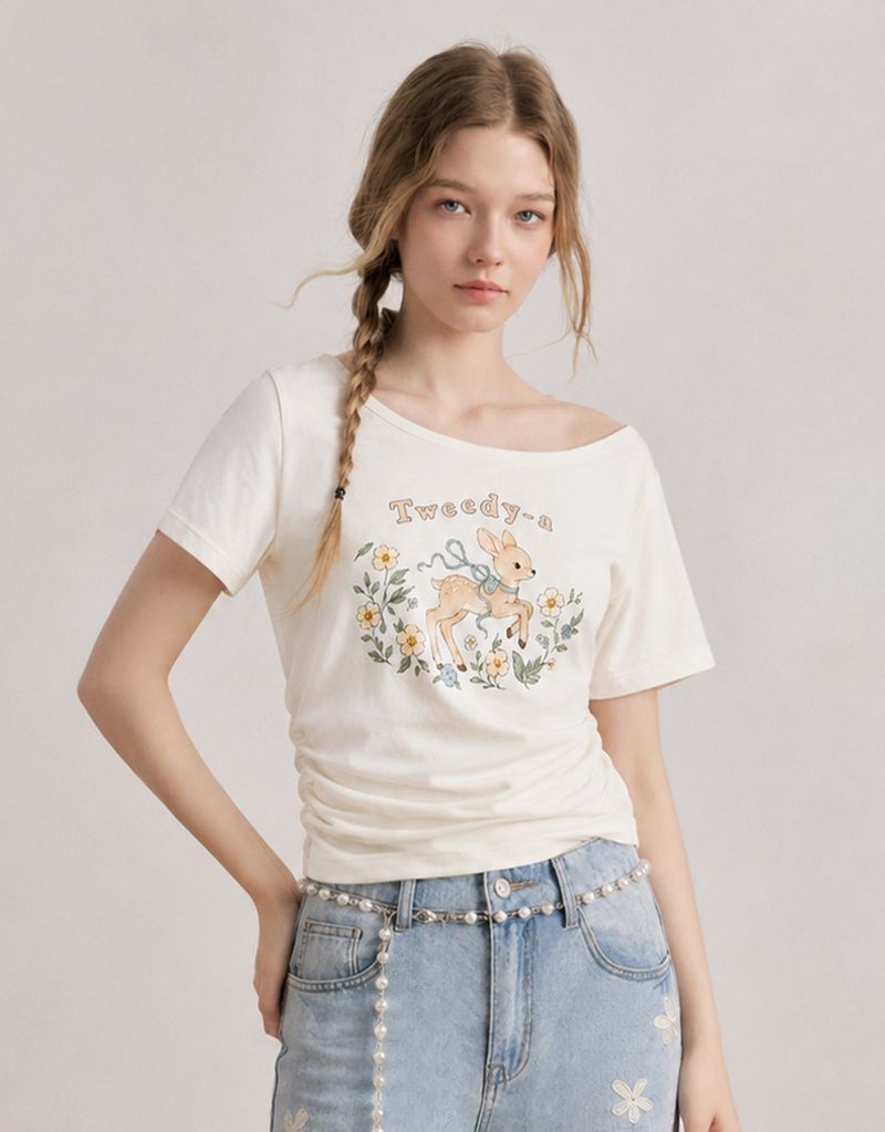 TWEEDY-A（ツウィーディア）の「ダイアサマーヴィンテージグラフィックシャーリングワンショルダーTシャツ アイボリー（トップス）」