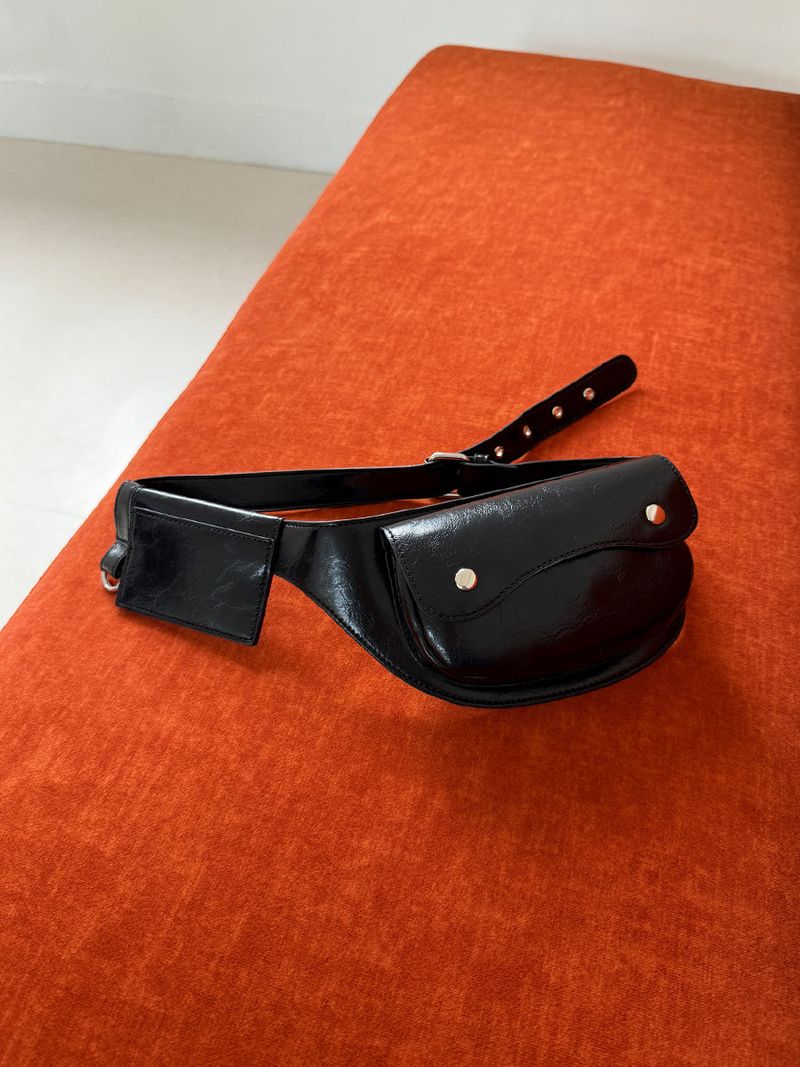 another language(アナザーランゲージ)の「rounded belt bag (Bags)」