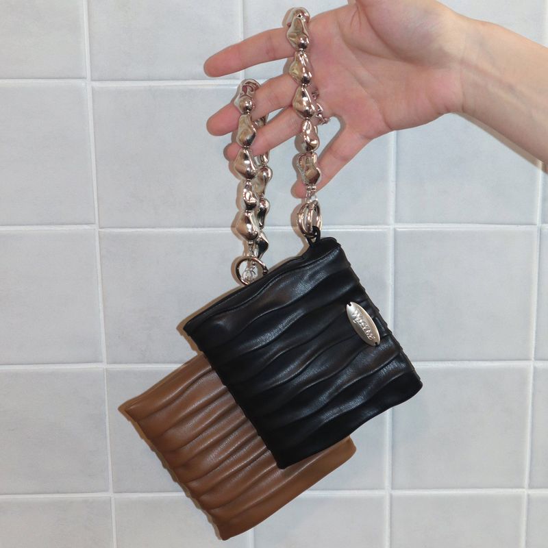 welcometoccc（ウェルカムシーシーシー）の「パド ペブル ウォレット (Black, Brown) （バッグ）」