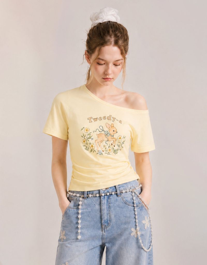 TWEEDY-A（ツウィーディア）の「ダイアサマーヴィンテージグラフィックシャーリングワンショルダーTシャツ バター（トップス）」