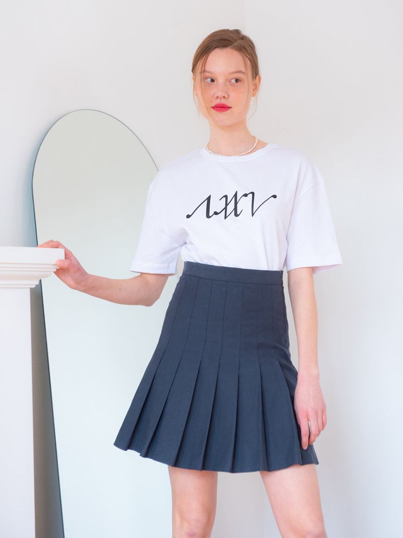 vem.ver（ベムバー）の「PLEATS SKIRT_NAVY（Skirts）」