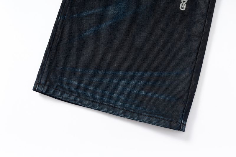 COATED KNIFE-SCRAPED HAND-WIPED DISTRESSED BOOTCUT JEANS