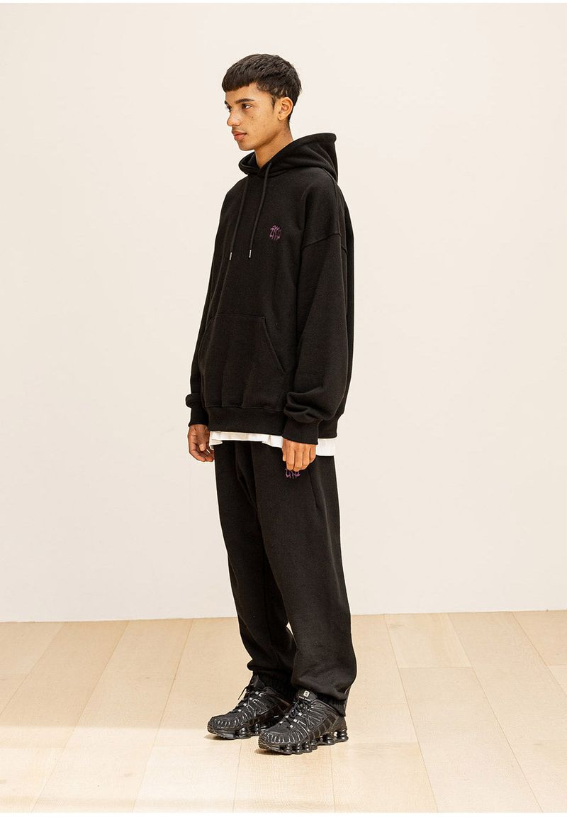 GRATING EMBLEM BACK SLIT ZIP PANTS