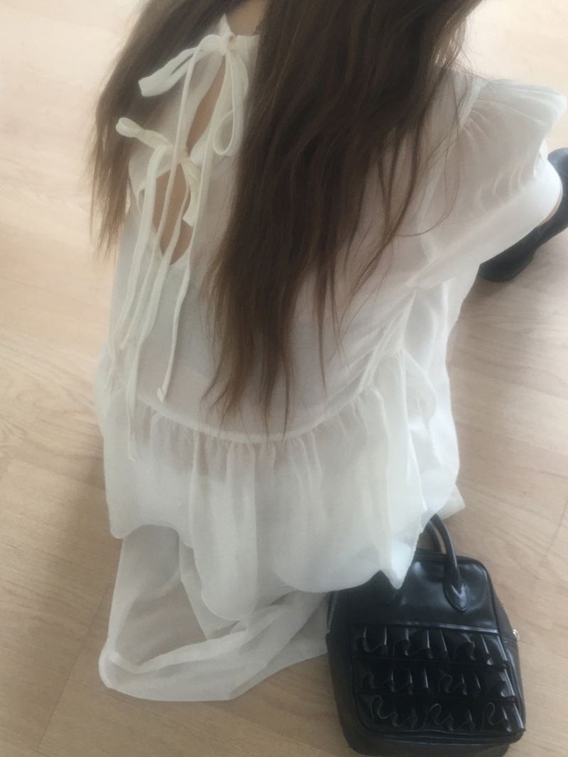 nobiyaka(ノビヤカ)の「Sheer back ribbon blouse(Tops)」