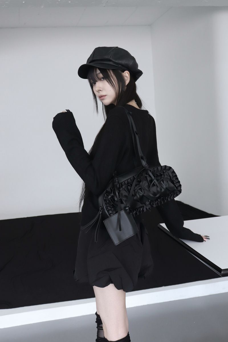black leather ribbon bag