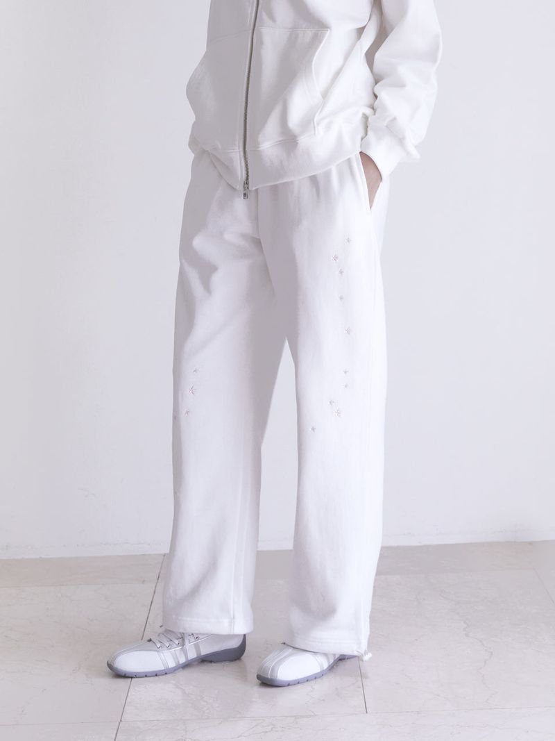 Innermuseum（インナーミュージアム）の「star embroidered two-way sweatpants (IVORY)（Pants）」