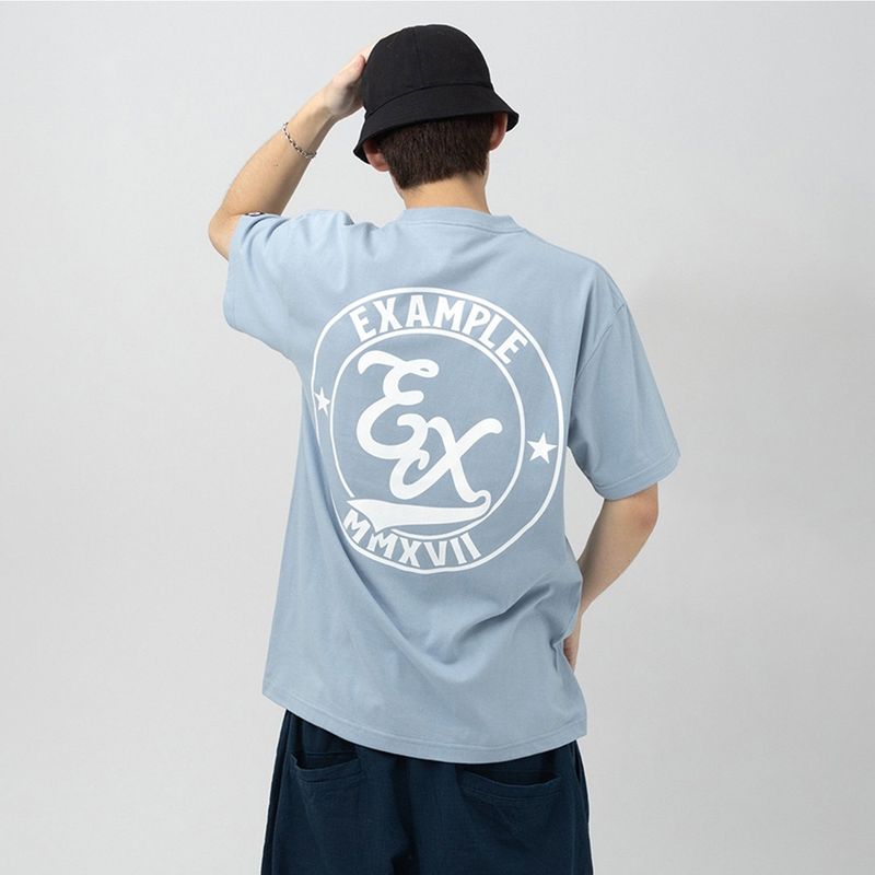 EXAMPLE（エグザンプル）の「EXAMPLE サークルEXロゴ半袖Tシャツ（トップス）」