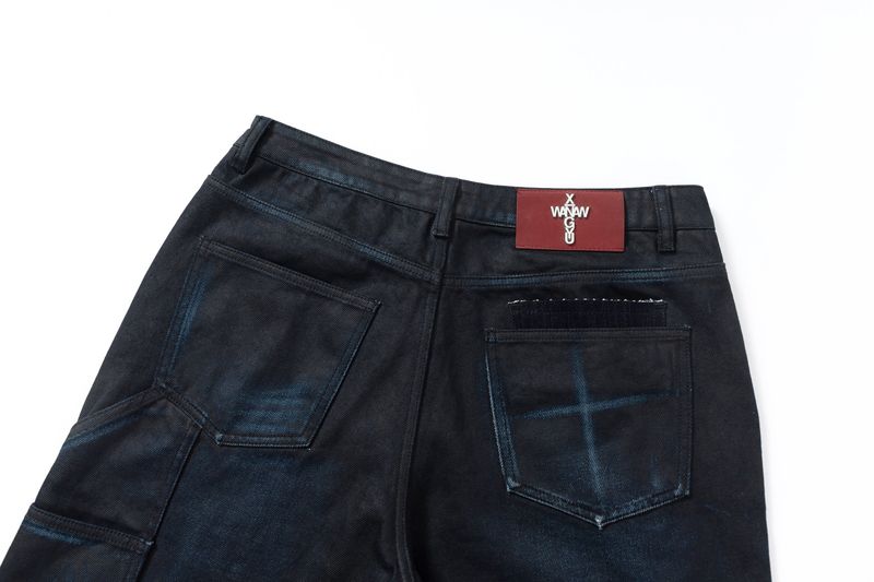COATED KNIFE-SCRAPED HAND-WIPED DISTRESSED BOOTCUT JEANS
