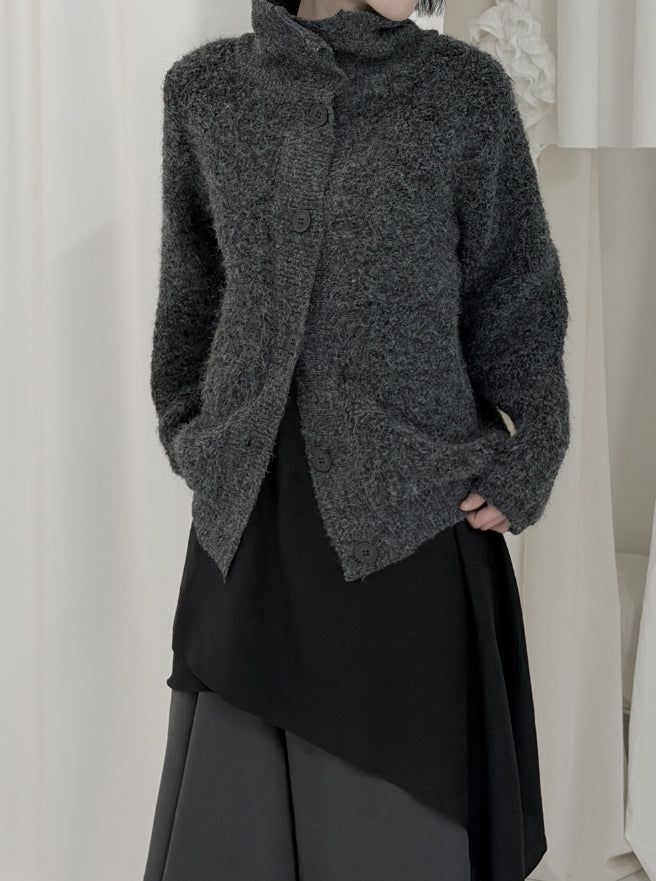 mnem（ムネム）の「Ketone High Neck Button Cardigan（Tops）」