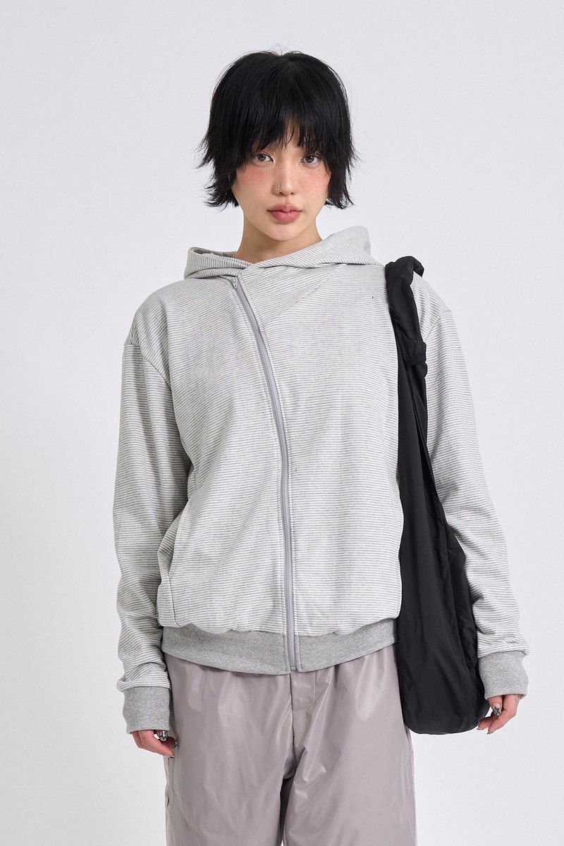 Raucohouse（ラウコハウス）の「City stripe unbalance hood zip-up（Tops）」