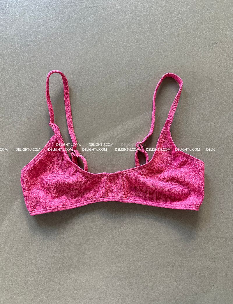 a set of 2 layered colored bikinis