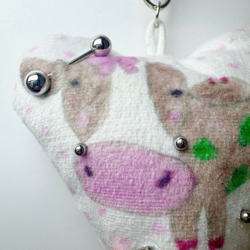 Pierced pinky cow keychain