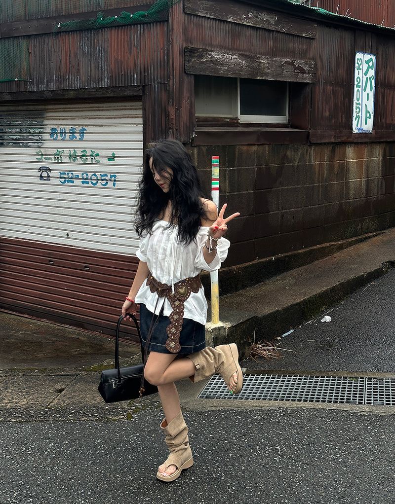 a raw paper stitch jean skirt