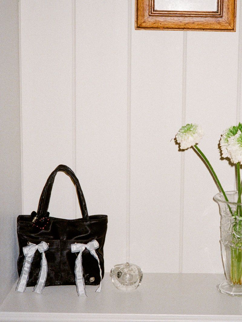 ovuni(オーブニ)の「Mini easy ribbon bag_black(Bags)」