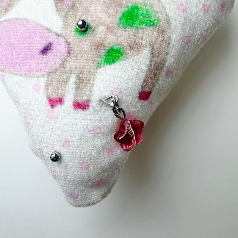Pierced pinky cow keychain