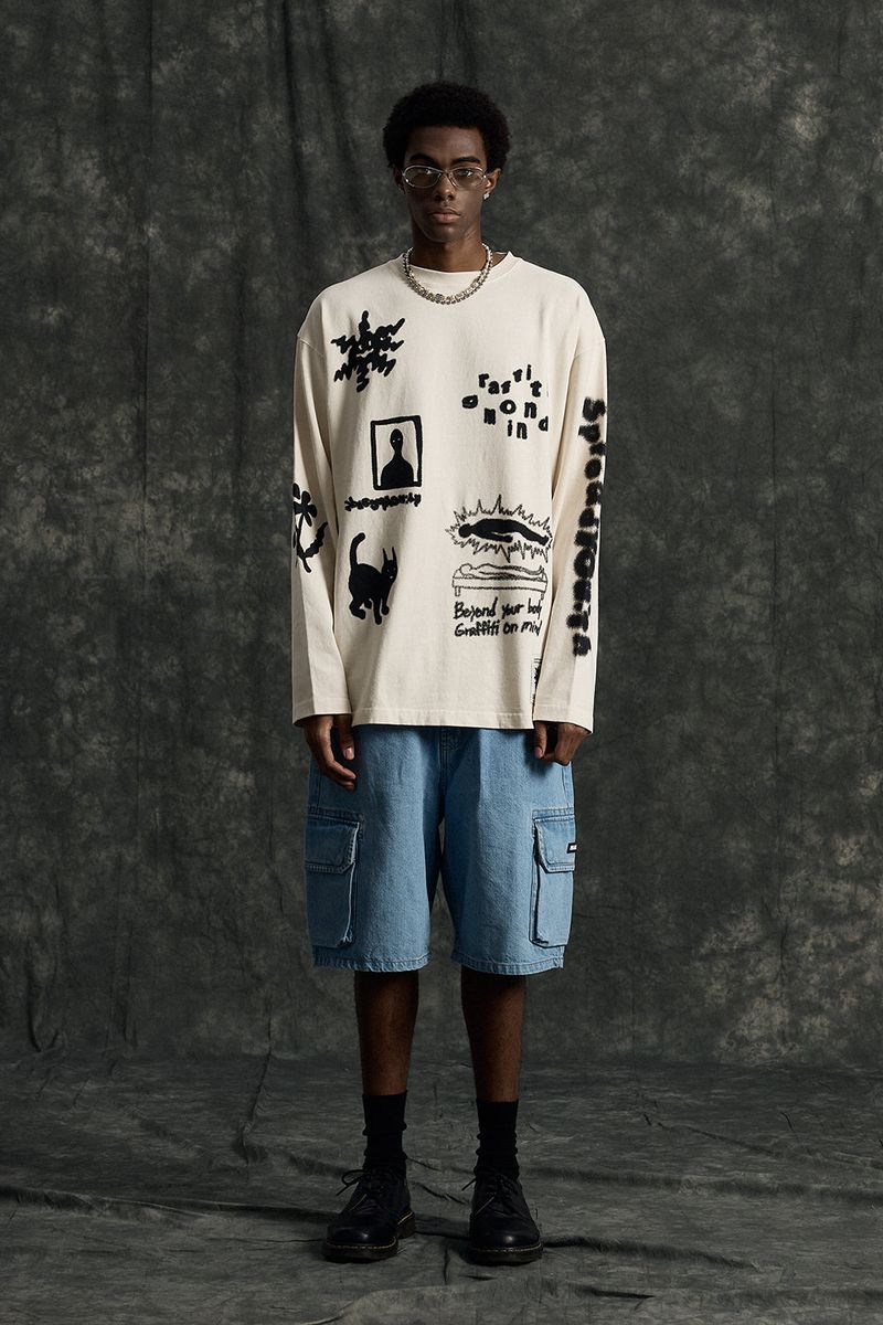 GRAFFITIONMIND（グラフィティオンマインド）の「Graffitionmind Graffiti LS Pigment T-shirt (Cream)（Tops）」