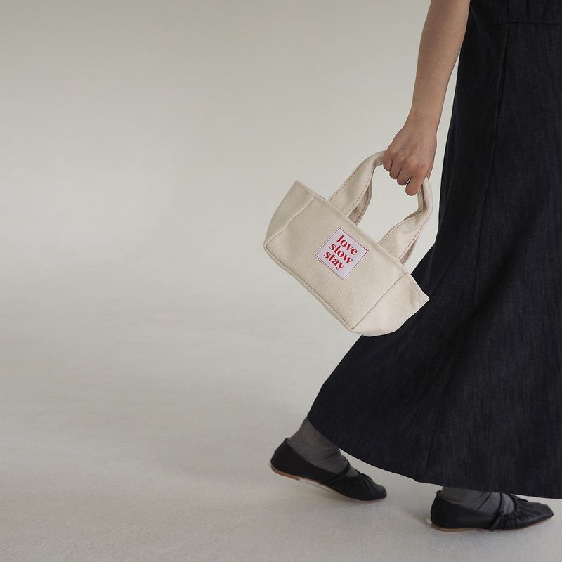 love slow stay（ラブ スロー ステイ）の「レッドスティッチトート　アイボリー（バッグ）」