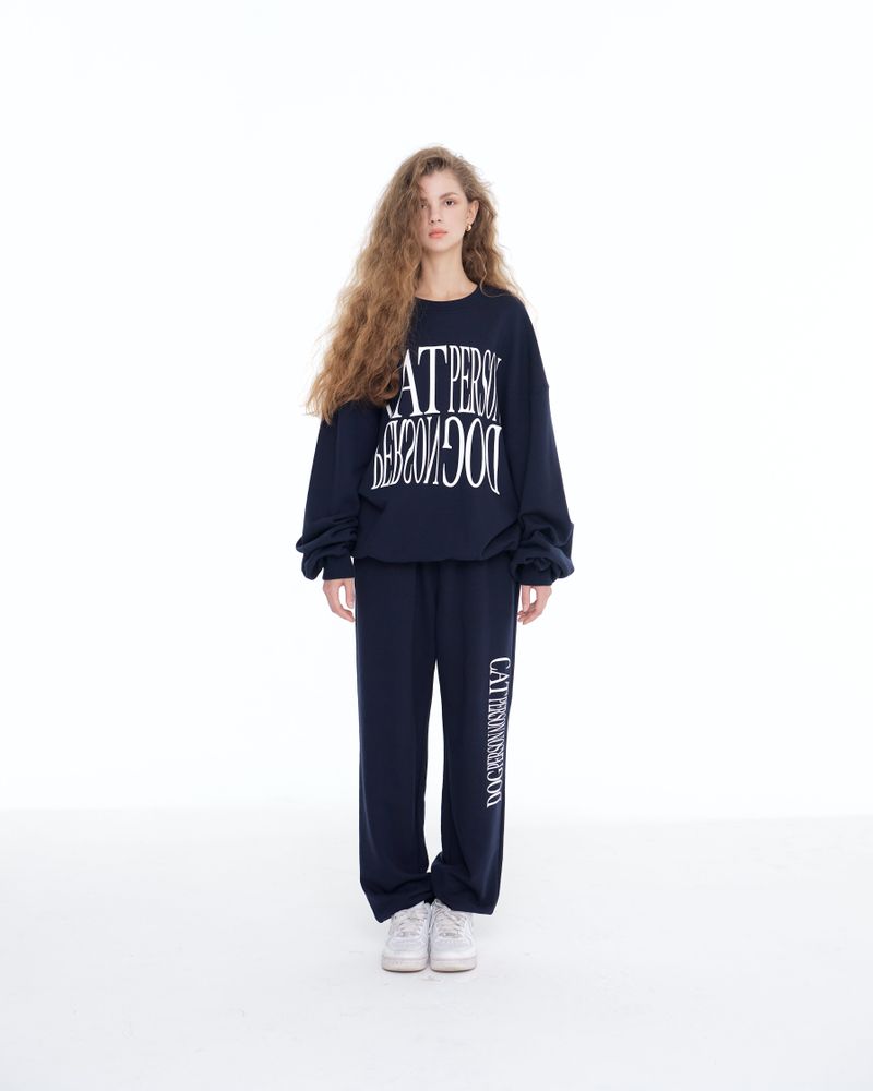 ITZAVIBE（イッザバイブ）の「[IBC22UPT05NA] CAT PERSON LETTERING JOGGER PANTS - NAVY（Pants）」