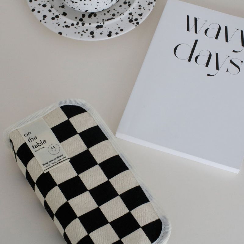On the table pen case (checkerboard)