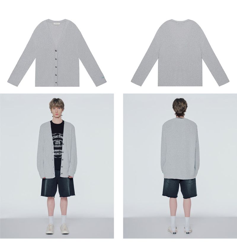 Distressed dequinned-knit cardigan