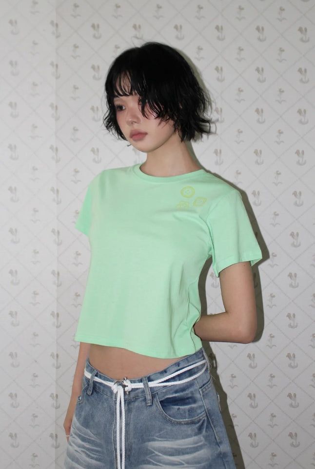 AAKE(アケ)の「MINI GRAPHIC TEE(Tops)」