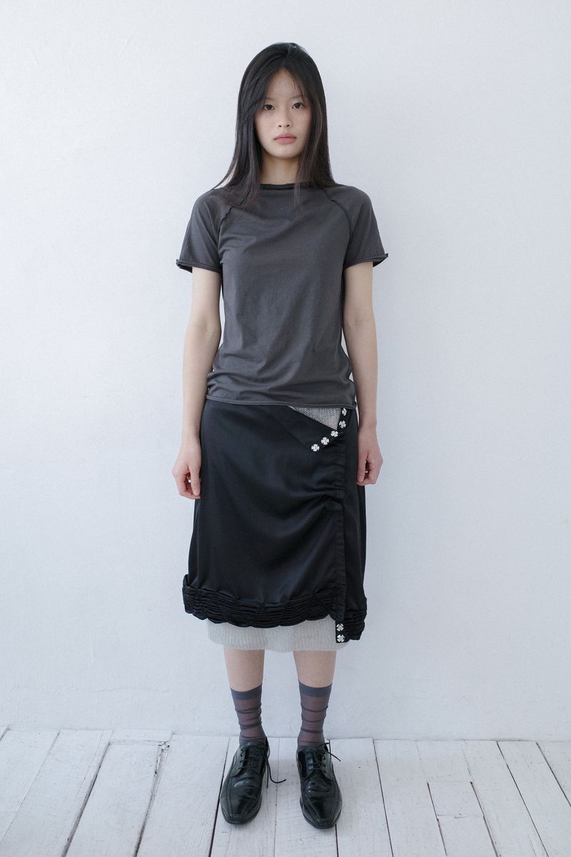 sankofa puella（サンコファ プエラ）の「リバーサルモックネックトップ (チャコール)（トップス）」