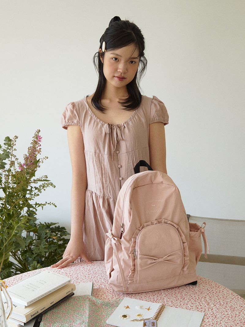 ovuni（オーブニ）の「Ruffle ribbon backpack_cotton pink（Bags）」