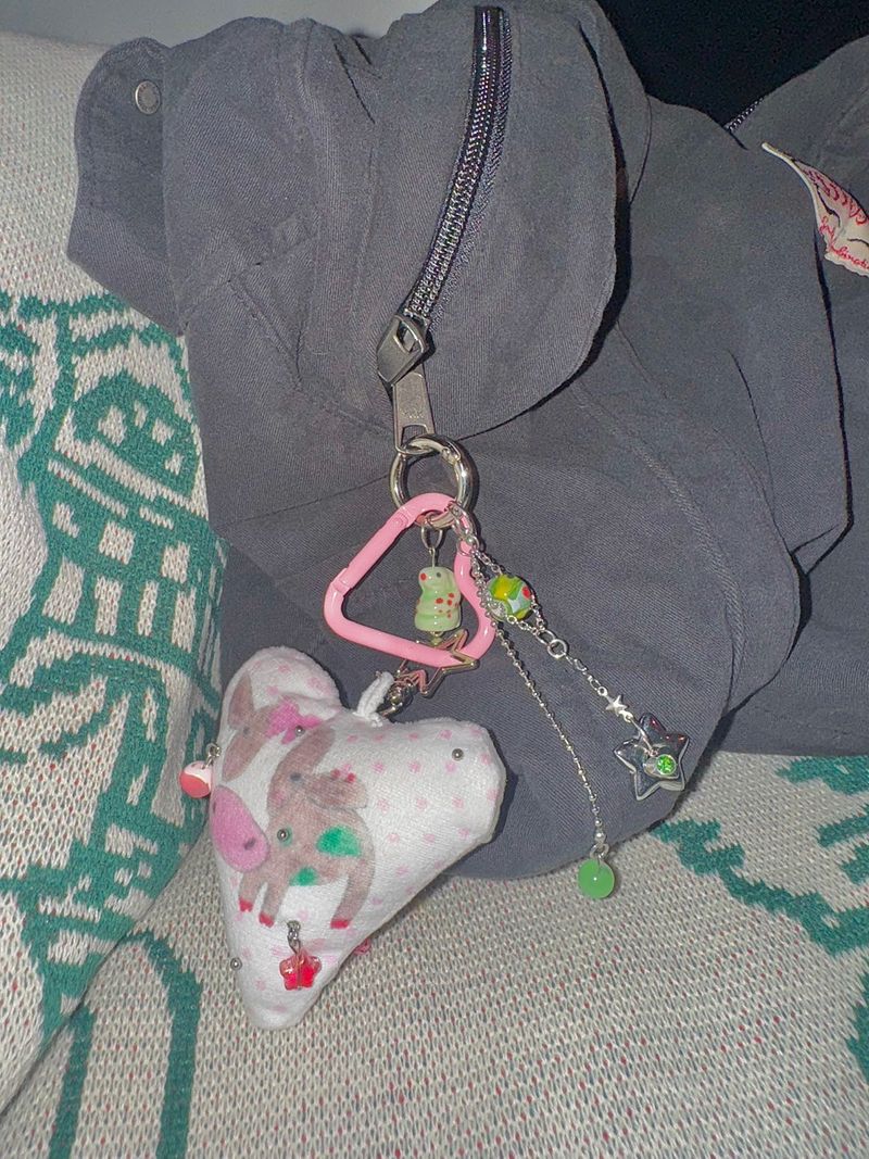 Pierced pinky cow keychain