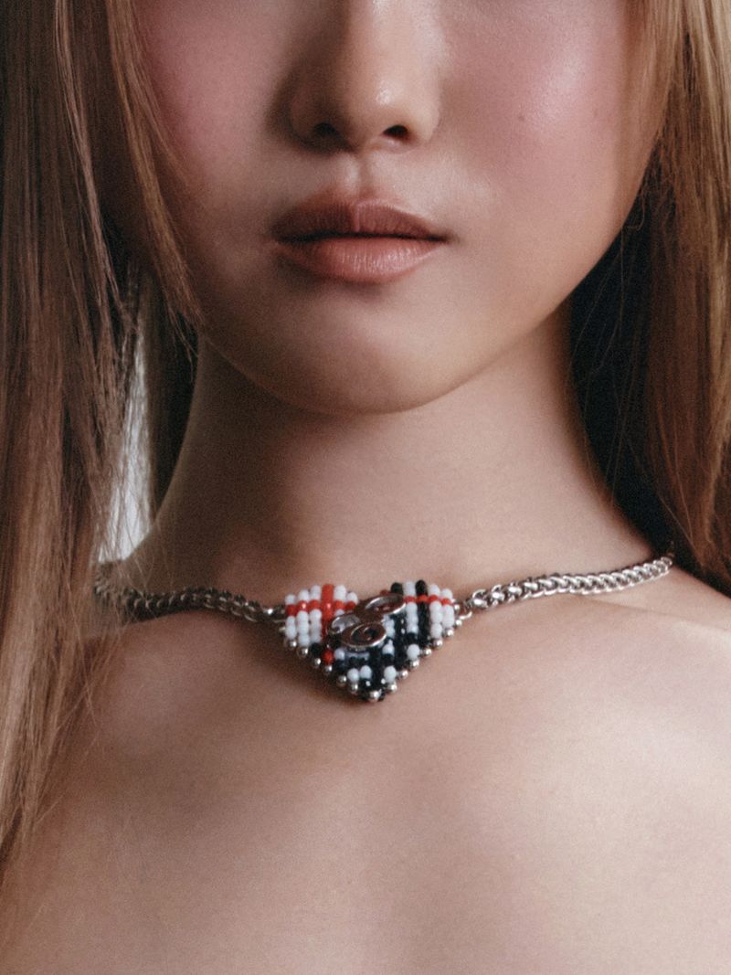 Eireve（エイレブ）の「BEADED TARTAN CHECK HEART NECKLACE (WHITE)（Accessories）」