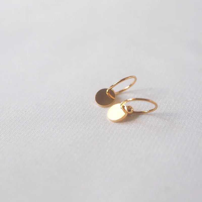 éclater（エクラテ）の「アネットフープディスクイヤリング（アクセサリー）」