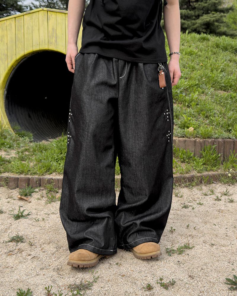 JIIGEUM（ジグム）の「Bone Cross Stud Wide Denim Pants（Pants）」