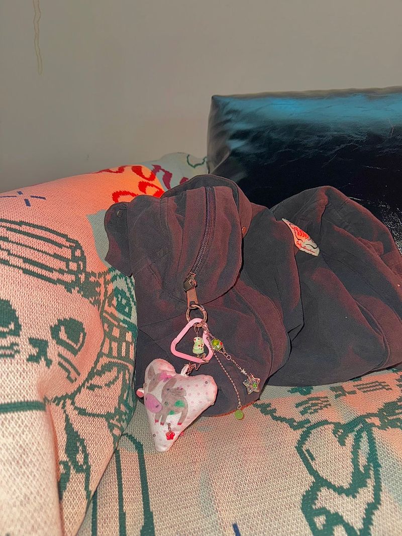 Pierced pinky cow keychain