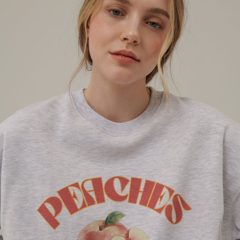 Between A and B(ビットウィーンエーアンドビー)の「PEACHES DRAWING SWEATSHIRT_WHITE MELANGE(Tops)」